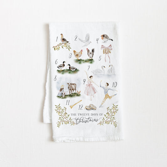 Flour sack tea towel featuring a watercolor illustrations inspired by the 12 Days of Christmas.