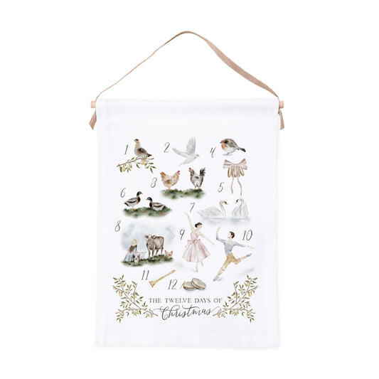 Decorative canvas wall hanging with watercolor illustrations inspired by 'The Twelve Days of Christmas' on a white background.