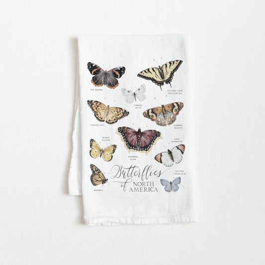Tea towel with watercolor butterfly illustrations and the text 'Butterflies of North America' on a white background