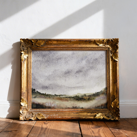 Framed painting on a wooden floor with a white wall background
