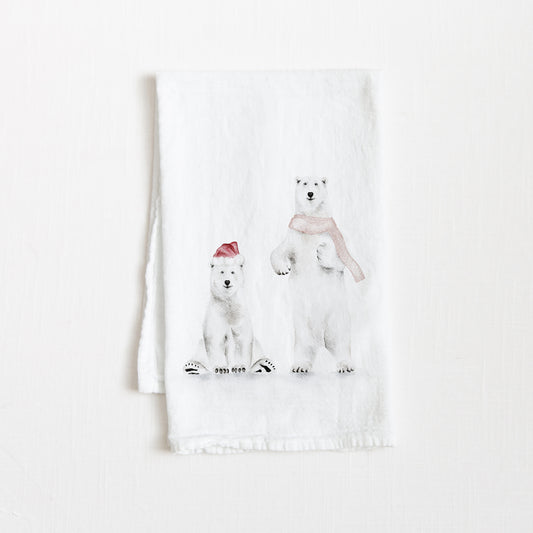 Holiday-themed flour sack tea towel featuring a watercolor illustration of holiday polar bears.