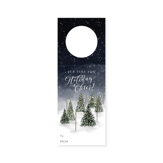 Set of 3 holiday wine bottle tags with a festive watercolor scene of snow and Christmas trees.