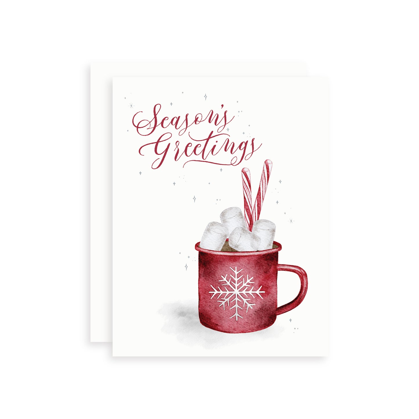 Christmas card with a watercolor illustration of a red mug of hot chocolate, marshmallows, and candy canes on a white background with the text 'Season's Greetings'