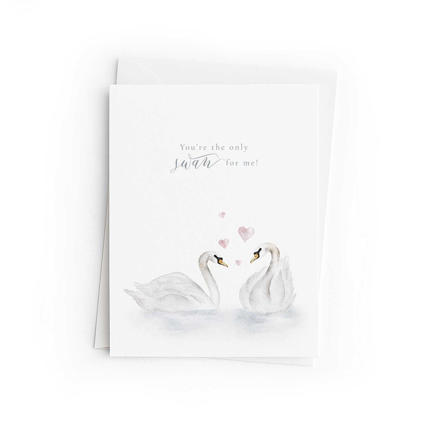 Greeting card with two swans and hearts on a white background