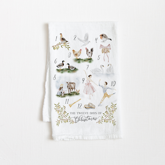 Tea towel with 'The Twelve Days of Christmas' design on a white background