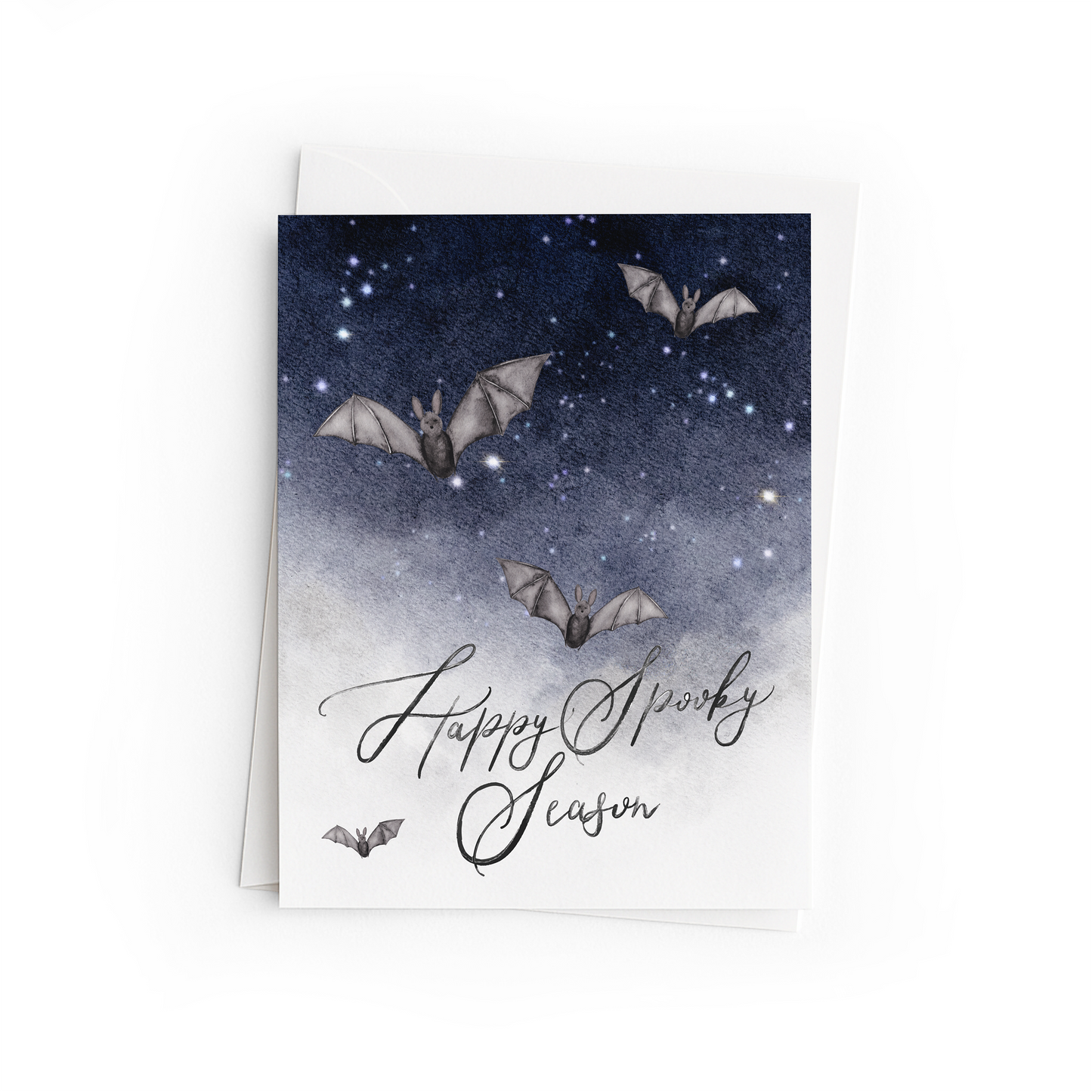 Greeting card with bats and 'Happy Spooky Season' text on a starry night background