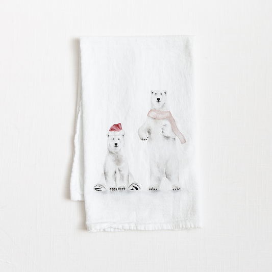 Tea towel with two watercolor holiday polar bears on a white background